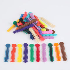 Random color elastomeric ligature ties with high elasticity and soft material.