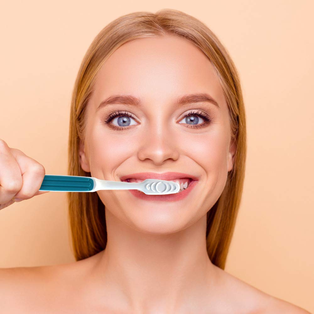 Toothbrush angled neck extending behind back teeth close-up