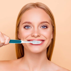 Toothbrush angled neck extending behind back teeth close-up