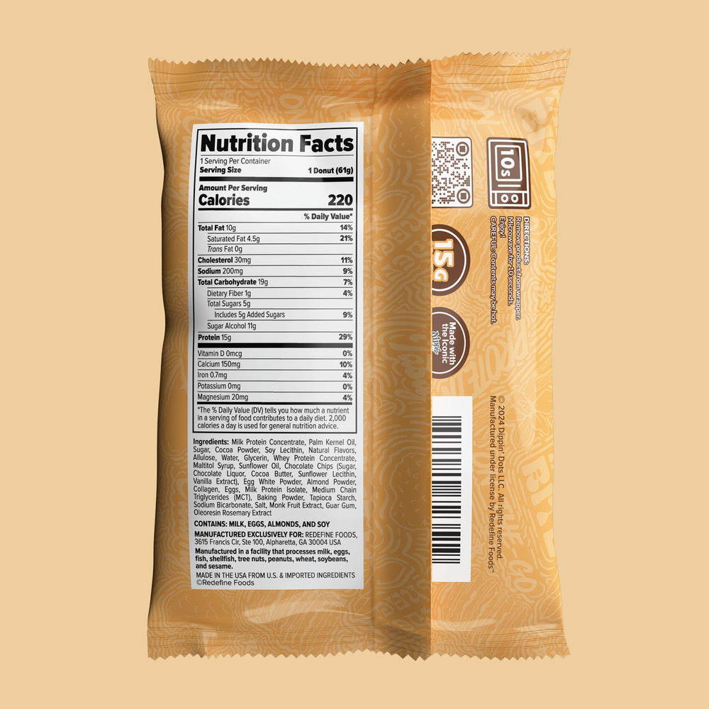 REDEFINE protein donut cross-section reveals creamy dough bits and cookie chips.