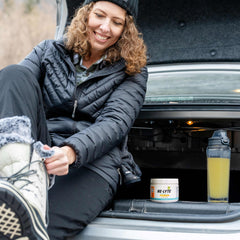 Serving scoop and glass of Re-Lyte Immunity Pineapple-Orange