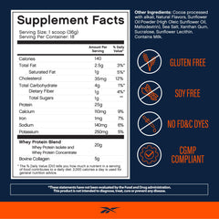 Reebok ReeBuild Chocolate Fudge shake in glass shows smooth, clump-free mixing for daily protein.