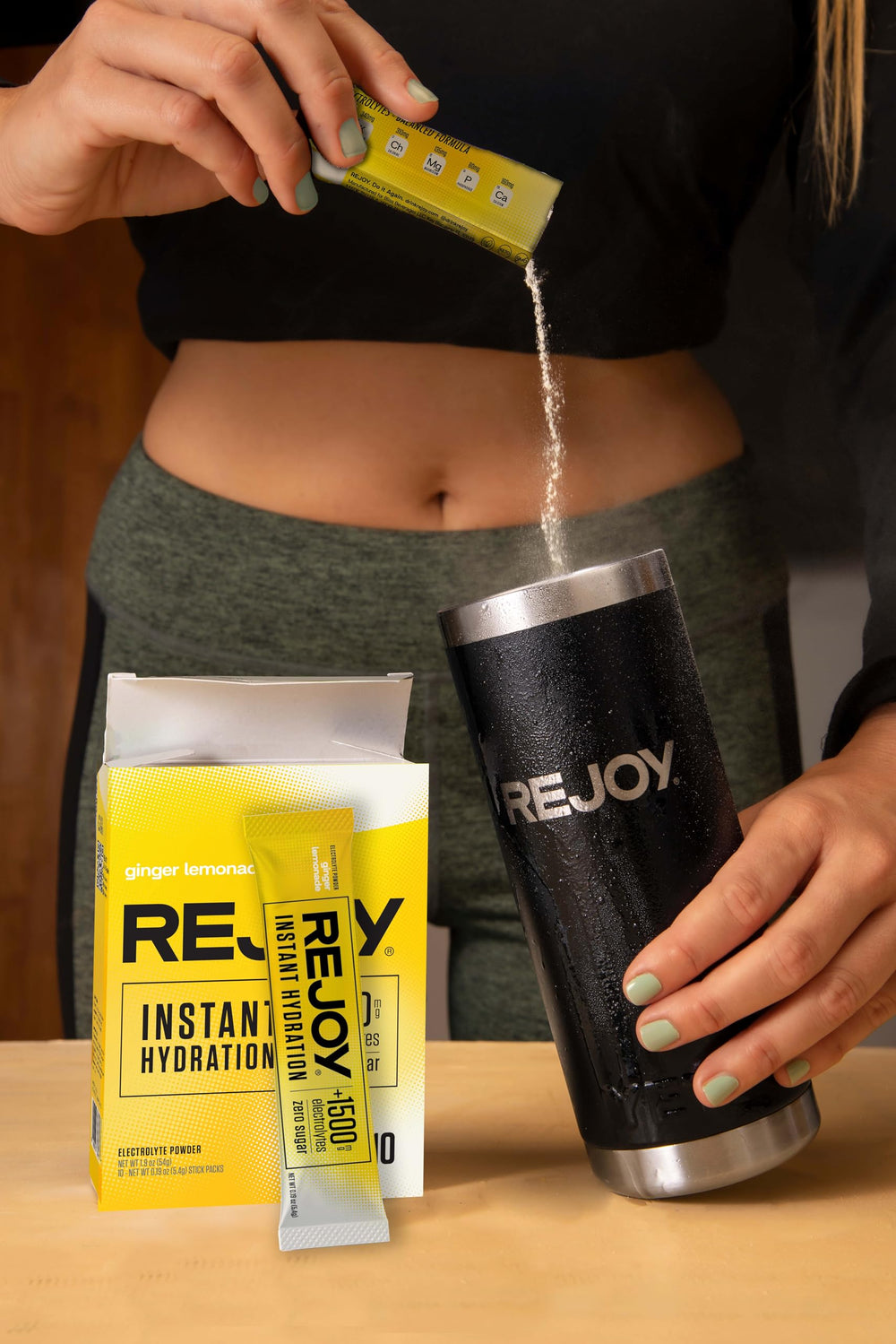 Athlete hydrating with Rejoy during training