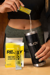 Athlete hydrating with Rejoy during training