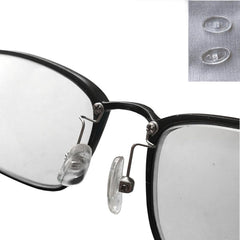 Packaging contents: arms, pads, and screwdriver