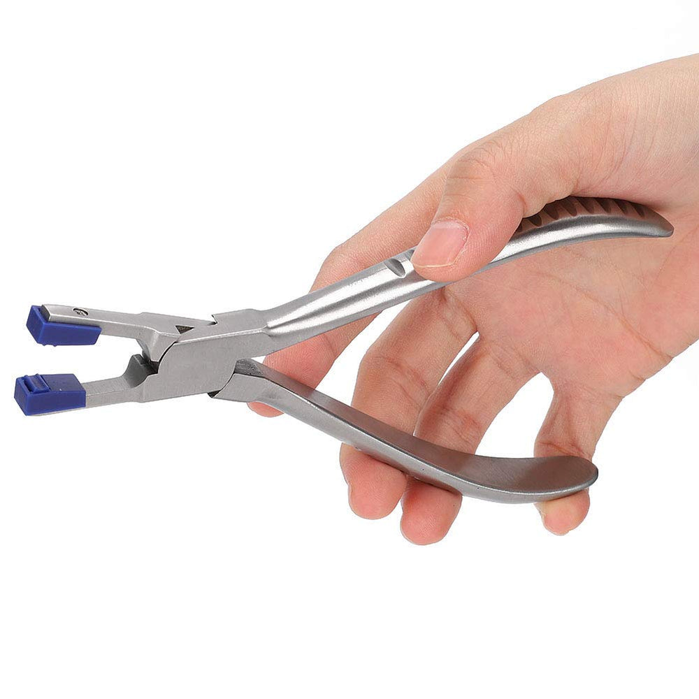 Close-up of stainless steel rimless glasses repair pliers