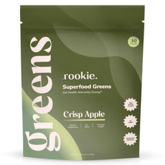 Rookie Wellness Greens powder scoop with glass of water