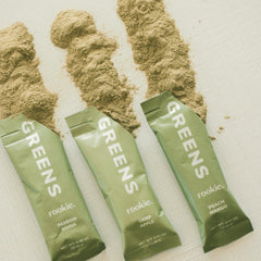 Morning smoothie setup with ice and a scoop of greens powder