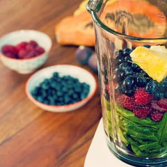 Glass of smoothie with Royal Tropics Green Papaya Powder