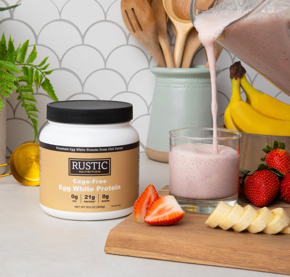 Pouring Rustic Nutrition egg white protein shake for a smooth, high-protein smoothie
