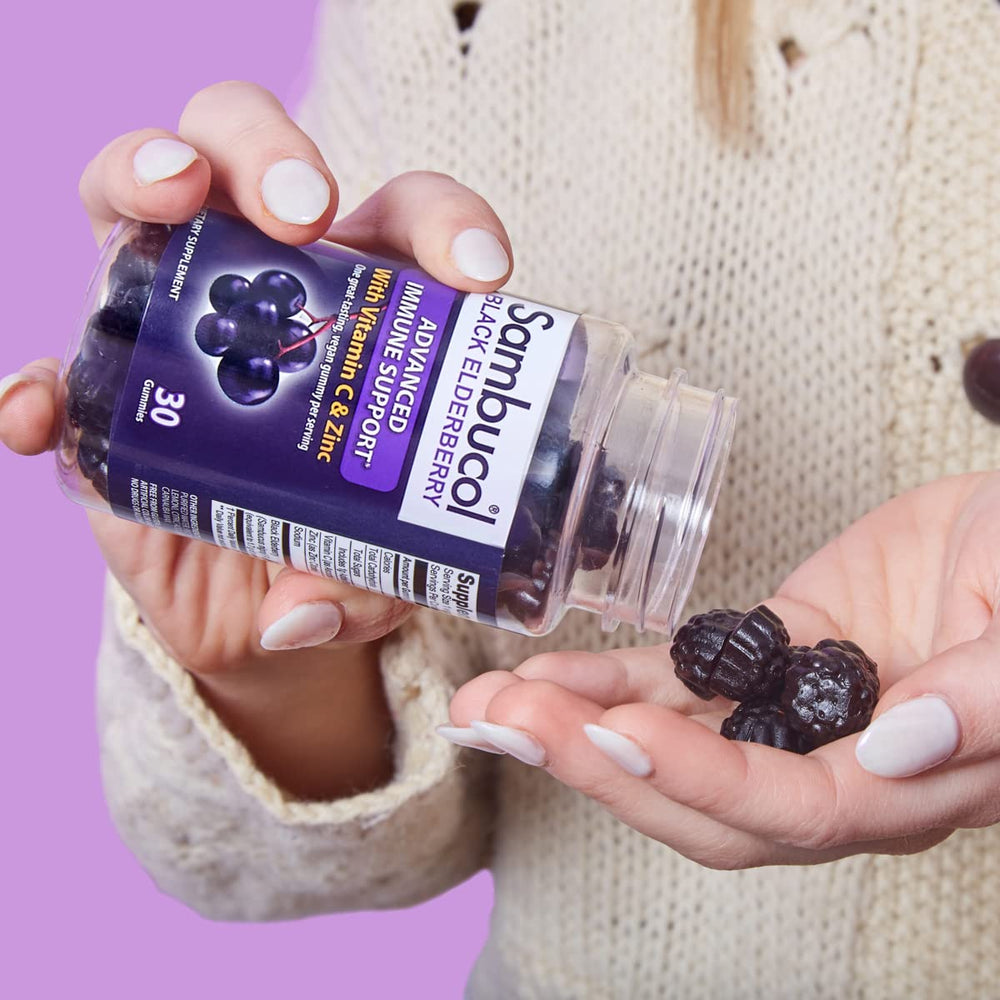 Sambucol elderberry gummies in use with berries
