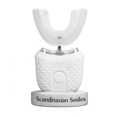 Front view of Scandinavian Smiles 360° electric toothbrush in white ergonomic handle