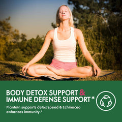 Dropper releasing herbal tincture into glass of water