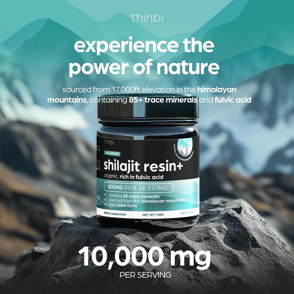 Premium glass jar of Shilajit resin with wooden spoon