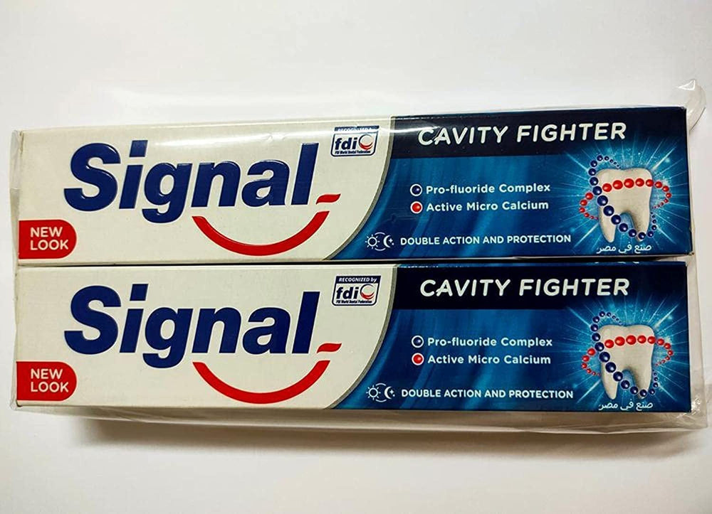 Packaging image showing two toothpaste boxes and tubes