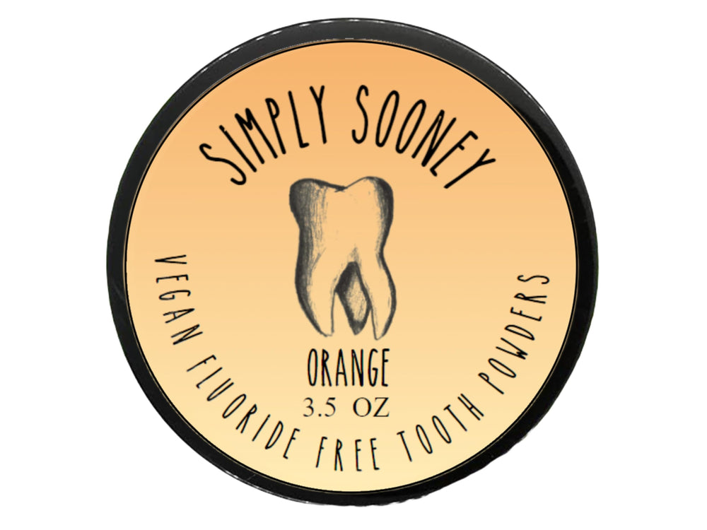 Orange-flavored fluoride-free remineralizing tooth powder in a jar