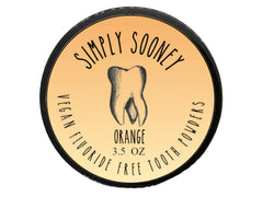Orange-flavored fluoride-free remineralizing tooth powder in a jar