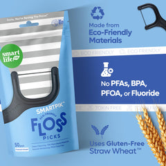 Dental floss picks held in hand showing slim design