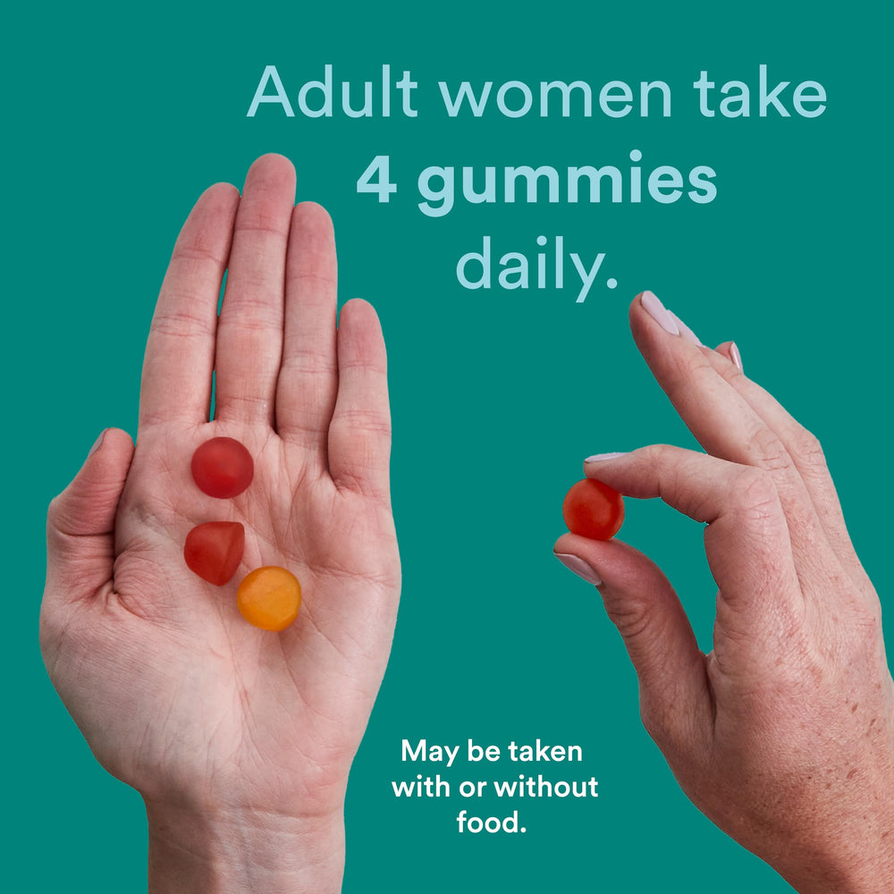 Hand holding four SmartyPants gummies illustrating the recommended daily dose