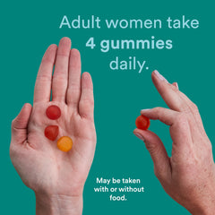 Hand holding four SmartyPants gummies illustrating the recommended daily dose