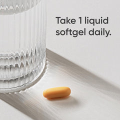 Close-up of liquid softgel capsules in bottle
