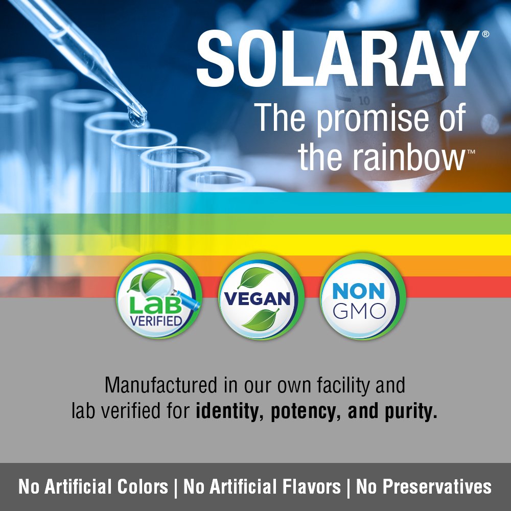 Bottle on white background with green leaves