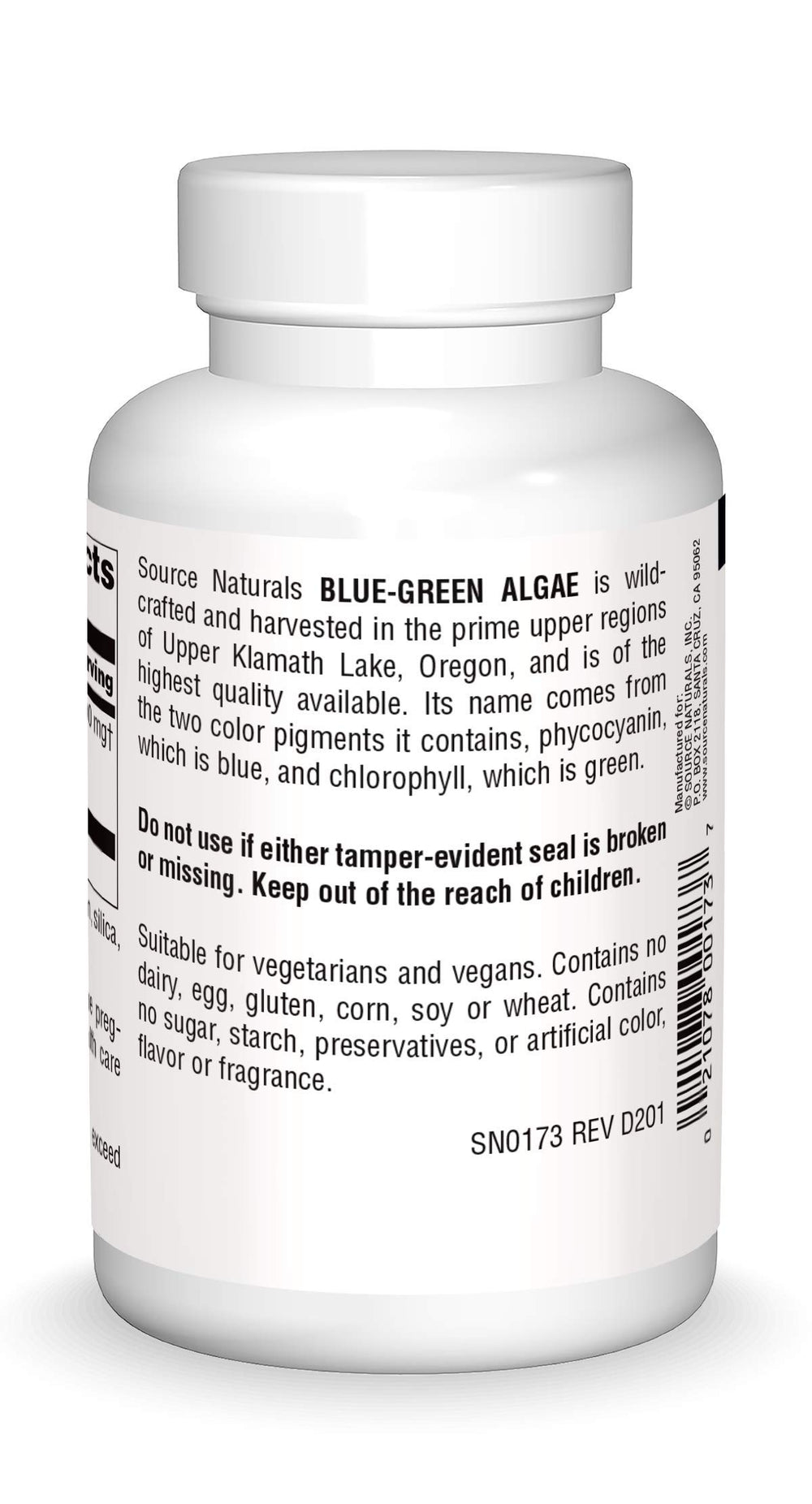 Close-up of blue green algae tablets in a bottle