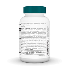 Two capsules being taken with a meal