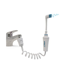 SoWash Vortice Brush Water Flosser connected to faucet with integrated bristles for brushing and flossing
