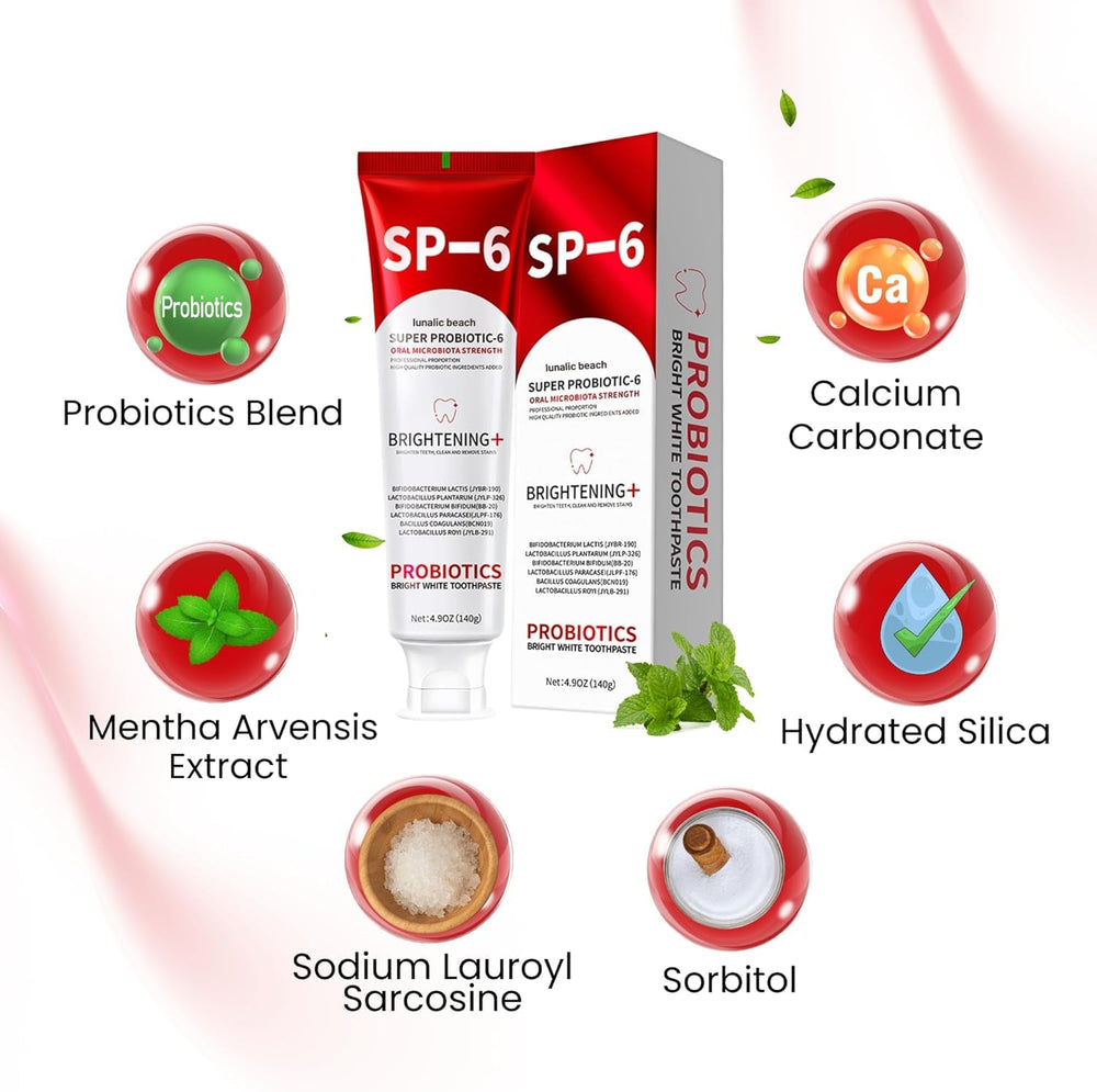 Fresh mint leaves beside toothpaste tube