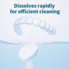 Tablet dissolving in warm water to clean dental appliances