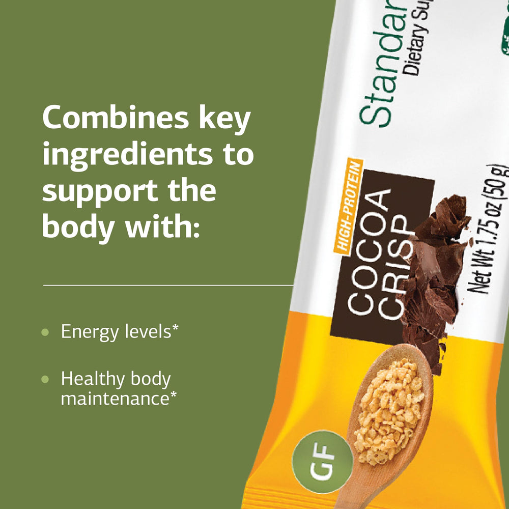 Standard Process StandardBar on-the-go snack beside a backpack for travel energy.