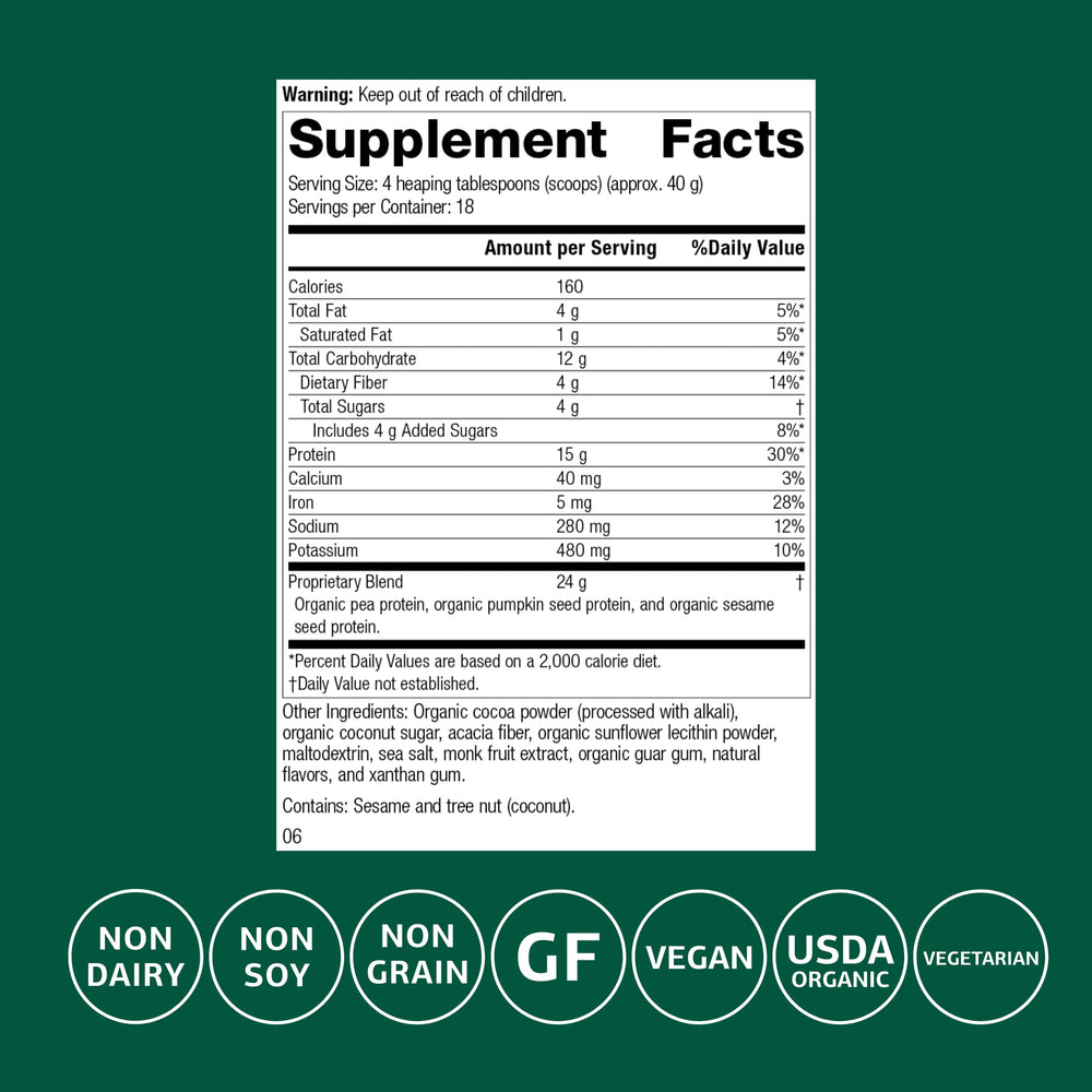 Standard Process Veg-E Complete Pro chocolate powder scoop closeup shows organic pea, pumpkin seed, and sesame proteins.