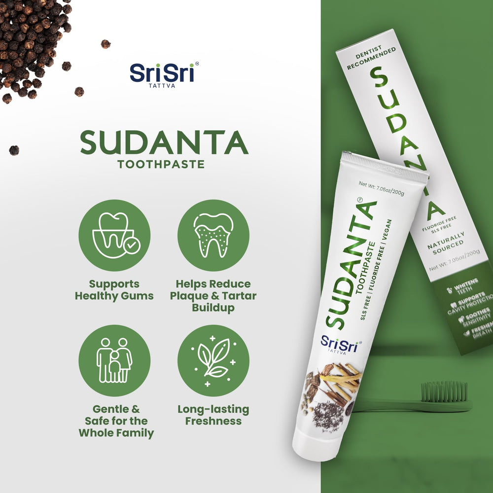 Close-up of Sudanta toothpaste tube with Ayurvedic herbs