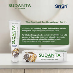 Person brushing teeth with Sudanta toothpaste