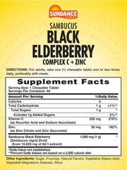 Close-up of elderberry chewable tablets in berry flavor