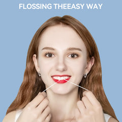 Close-up of floss sliding between teeth