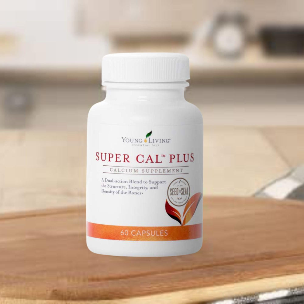 Bottle with capsules beside a glass of water