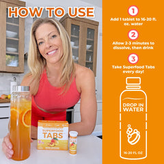 Superfood Tabs Peach Mango dissolving in water into a crisp, energizing drink