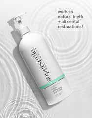 Smiling person showcasing bright teeth after using Supersmile Pre-Rinse