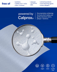 Close-up of dissolving whitening strips being applied