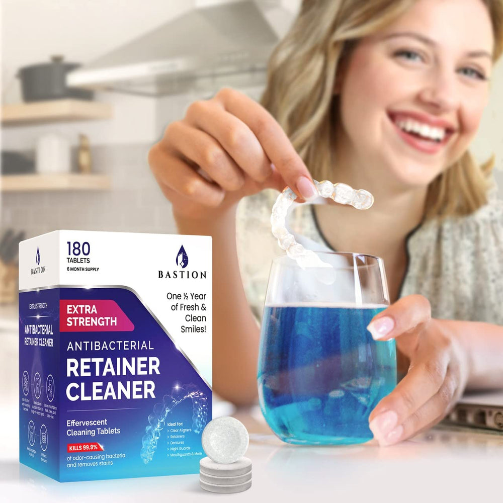 Effervescent tablets dissolving in water for cleaning dental devices