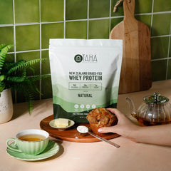 Taha Health & Nutrition whey powder in a shake glass, convenient protein boost for routines.
