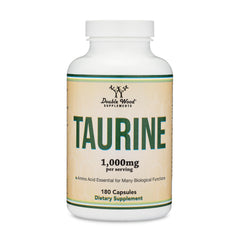 Lifestyle image showing Taurine supplement bottle with glass of water