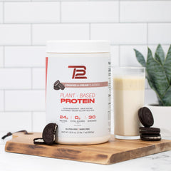 Lifestyle image of TB12 plant-based protein powder with smoothie