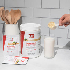 TB12 vanilla plant-based protein powder bottle with scoop