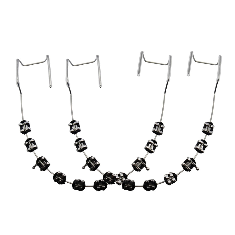 Black fake braces on a dental mold for teaching