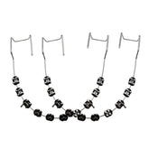 Black fake braces on a dental mold for teaching