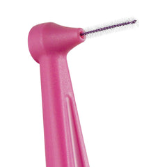 Tepe pink interdental brush being used to clean between teeth