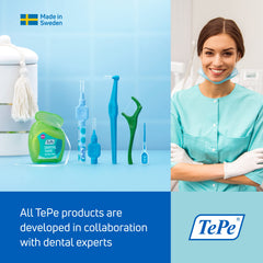 TePe Supreme next to a hand to show compact head size and comfortable scale